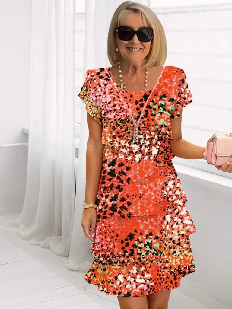 Brigitte – Vestido elegante e fluido com volantes